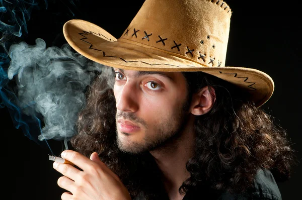 Man in cowbow hat smoking — Stock Photo, Image