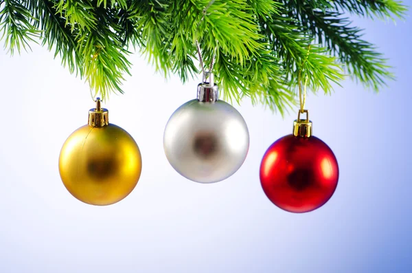 Baubles on christmas tree in celebration concept Stock Photo