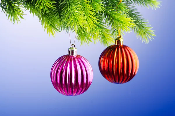 Baubles on christmas tree in celebration concept Stock Photo