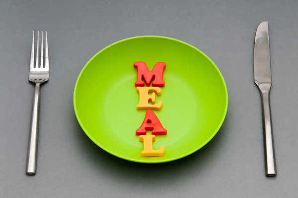 Plate with letters on the white background — Stock Photo, Image
