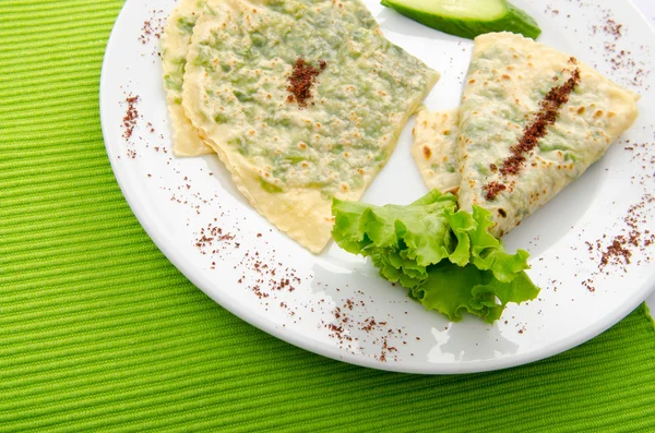 Pancake with herbs in the plate — Stock Photo, Image