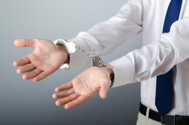 Businessman handcuffed for his crimes clipart