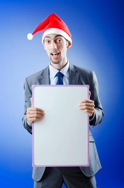 サンタ帽子とメッセージを持ったビジネスマン — ストック写真