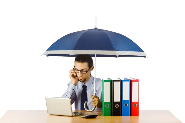 Empresario sosteniendo paraguas en la oficina —  Fotos de Stock