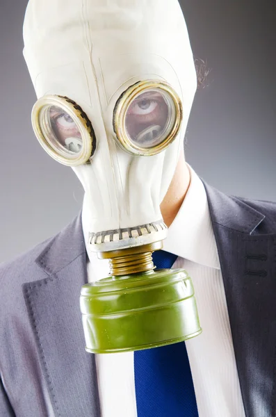 Businessman wearing gas mask — Stock Photo, Image