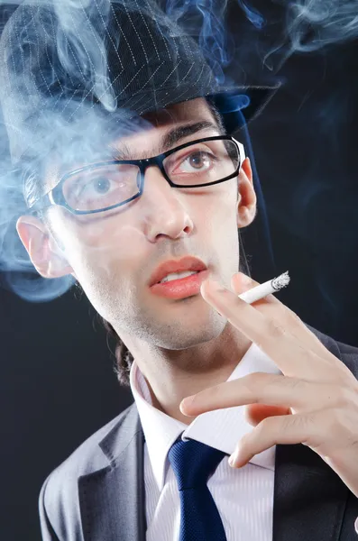 Young man smoking cigarette — Stock Photo, Image