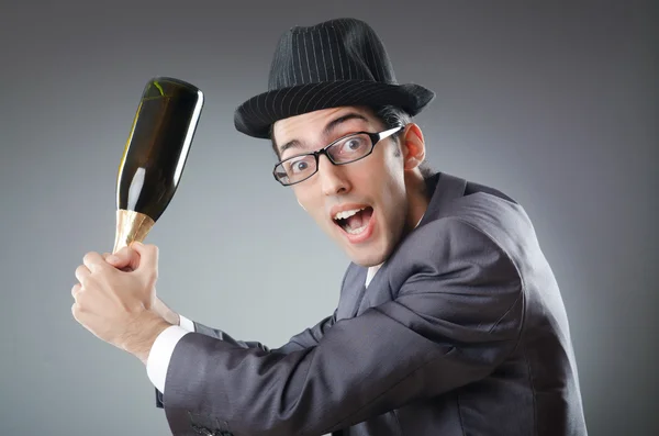 Businessman with bottle of champagne — Stock Photo, Image