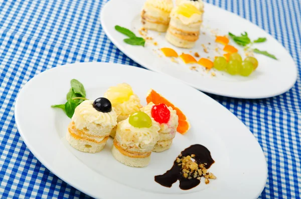 stock image Plate full of tasty mini cakes