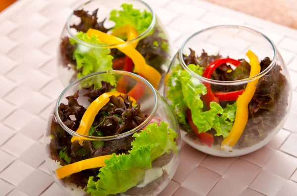 Tasty salad served in glasses — Stock Photo, Image