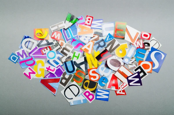 Newspaper clippings with various letters — Stock Photo, Image