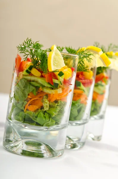 Tasty salad served in glasses — Stock Photo, Image
