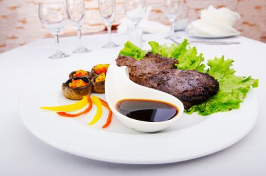 Well done steak served in the plate clipart