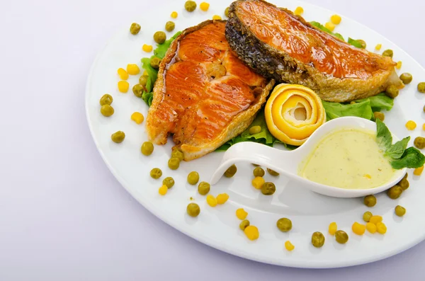 Roasted salmon in the plate — Stock Photo, Image