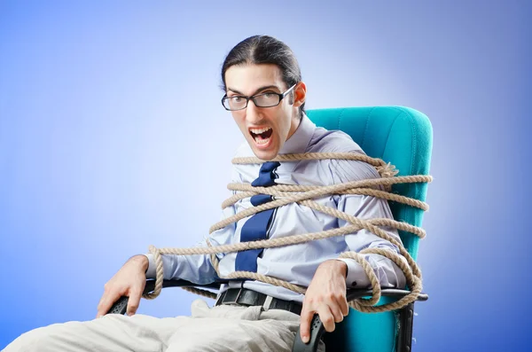 Jovem empresário amarrado com corda — Fotografia de Stock