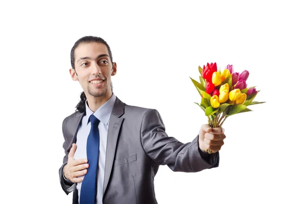 Jongeman met tulp bloemen — Stockfoto