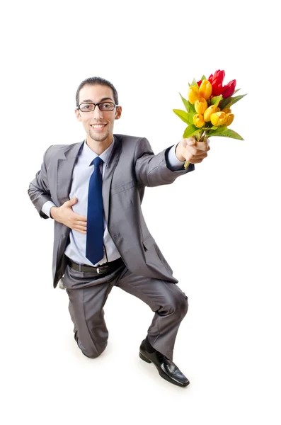 Empresário oferecendo flores de tulipa — Fotografia de Stock
