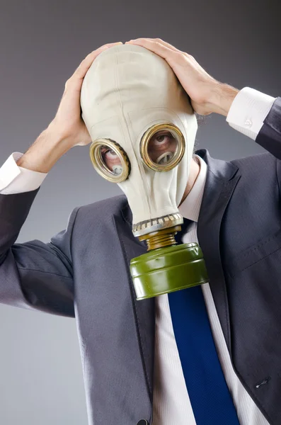 Businessman wearing gas mask — Stock Photo, Image