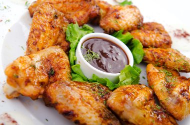 Chicken wings in the plate clipart