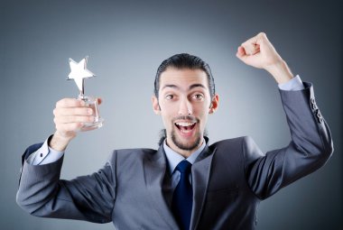 Businessman awarded with star award clipart