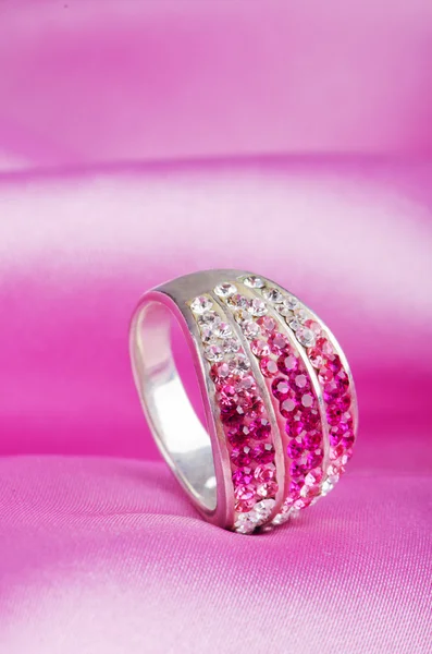 Jewellery ring on the satin background — Stock Photo, Image