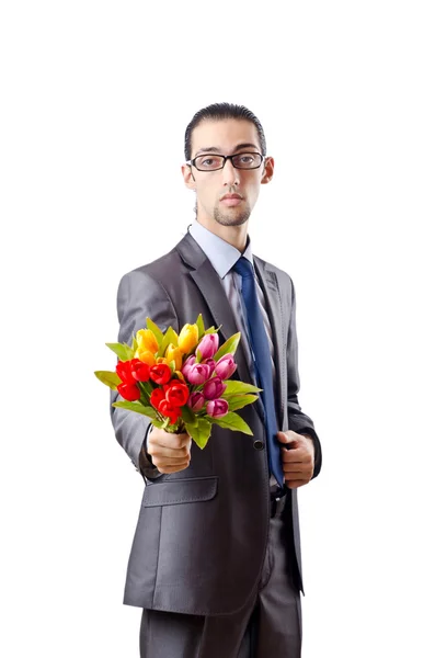 Młody człowiek z kwiatów tulipanów — Zdjęcie stockowe