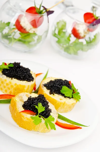 Black caviar in the plate — Stock Photo, Image