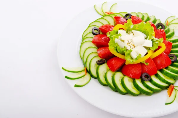Cucumber and tomato salad in plate — Stock Photo, Image