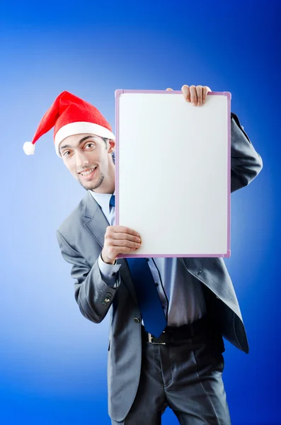 Geschäftsmann mit Weihnachtsmütze und Botschaft — Stockfoto