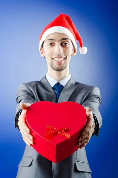 Zakenman aanbieden van geschenken op Kerstmis — Stockfoto