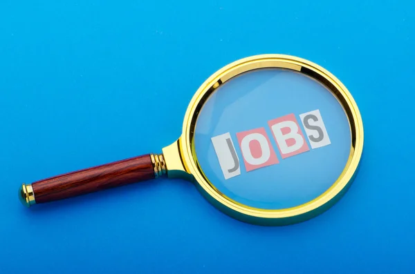 Concetto di disoccupazione con lente d'ingrandimento — Foto Stock