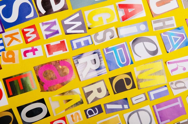 Newspaper clippings with various letters — Stock Photo, Image