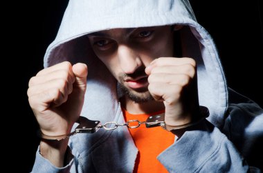 Young criminal with handcuffs clipart