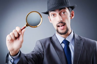 Detective and magnifying glass clipart