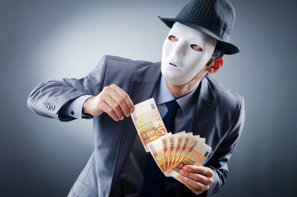 Empresario con dinero y máscara — Foto de Stock