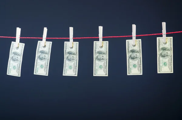 Concept met dollars op het touw witwassen van geld — Stockfoto