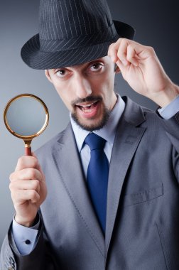 Detective and magnifying glass clipart