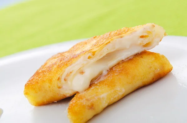 Custard filled pancake in plate — Stock Photo, Image