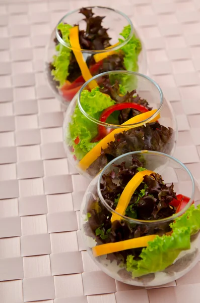 Tasty salad served in glasses — Stock Photo, Image