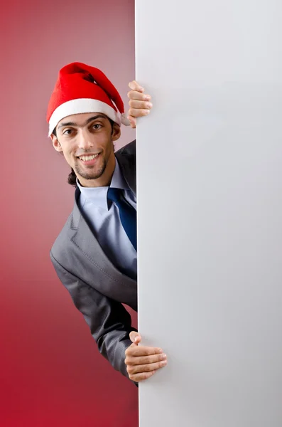 Biznesmen w santa hat z pustą wiadomość — Zdjęcie stockowe