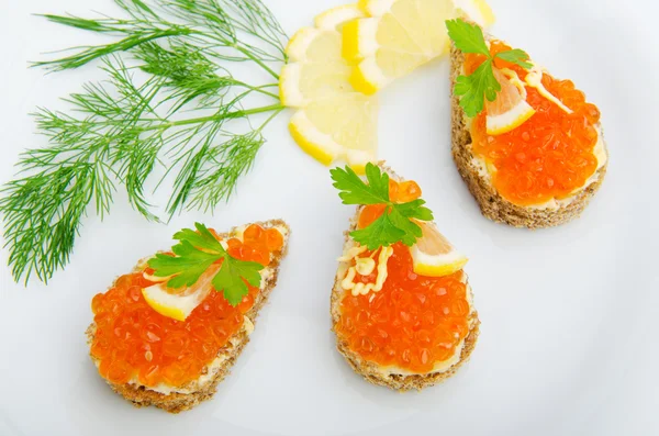 Red caviar served in the plate — Stock Photo, Image