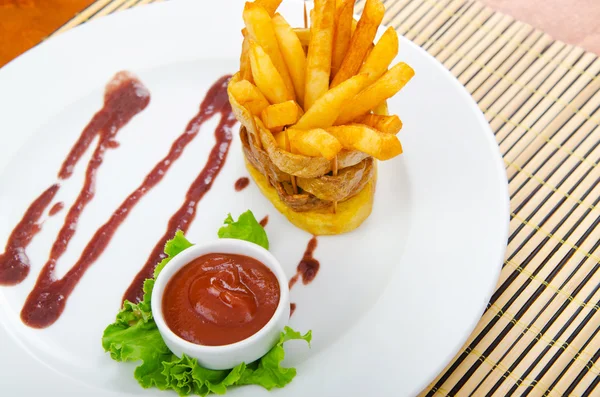 French fries served with ketchup — Stock Photo, Image