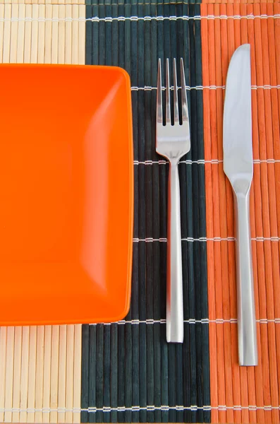 Food utensils on the mat — Stock Photo, Image