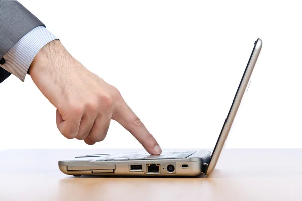 Hand pressing buttons on laptop — Stock Photo, Image