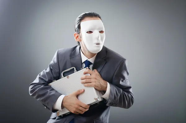 Industrial espionate concept with masked businessman Stock Photo