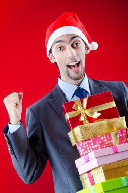 Businessman offering gifts on christmas clipart