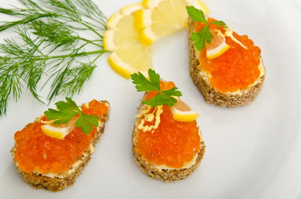 Red caviar served in the plate — Stock Photo, Image