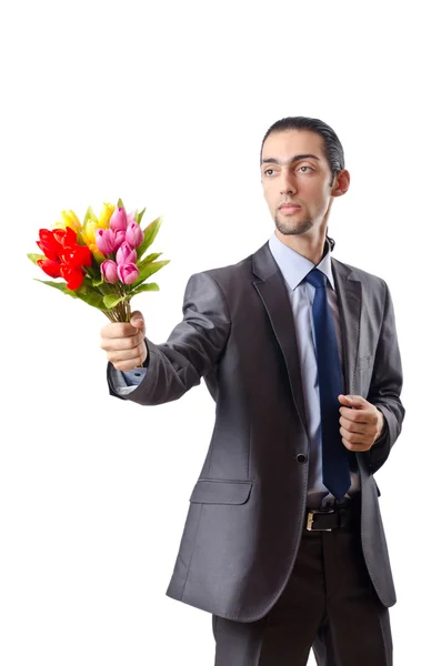 Hombre joven con flores de tulipán —  Fotos de Stock
