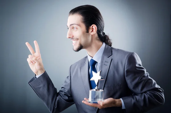 Affärsman med star award — Stockfoto