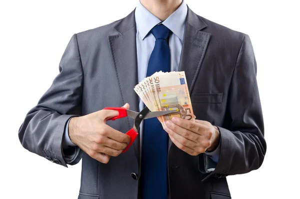 Hombre cortando dinero en blanco — Foto de Stock