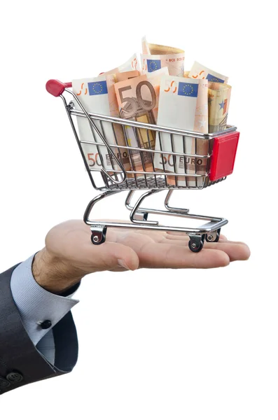 Shopping cart full of money — Stock Photo, Image